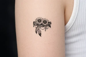 sunflowers with feathers and female Indian tribal ribbon cascading upper arm tattoo idea