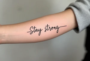 “Stay strong” in bold black script wrapped with a dark red heartbeat line. tattoo idea