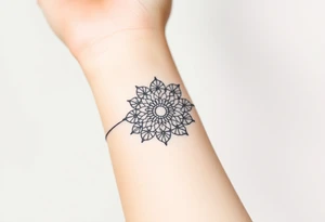 A delicate lace armband going around in a mandala style, incorporating intricate, circular details tattoo idea