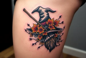 Which is broom with handle
 a witches hat with fall maple leaves and vines tattoo idea