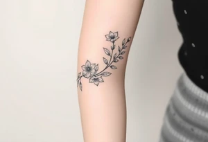 starting from a band mid forearm, narcissus flowers and holly flowers going up the arm tattoo idea