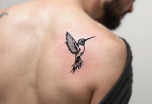 smaller hummingbird with Indigenous style tattoo idea