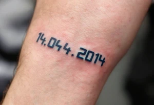 Digital-style 14.04.2014 in pixelated black font with neon-free, dark cyan touches. tattoo idea