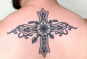 a celtic cross with irish inspired details and a four leaf clover adding other celtic elements surrounding the cross tattoo idea