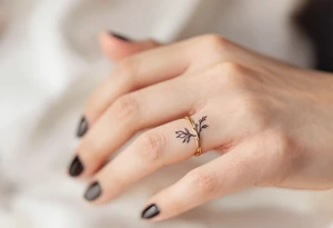 A thin, delicate gold ring tattoo tattoo idea