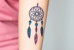 native dreamcatcher with flowing feathers and sacred beads tattoo idea