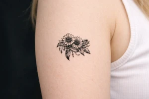 sunflowers with feathers and female Indian tribal ribbon tattoo idea