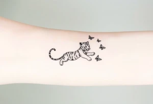 Tiger cub stretching catching 3 butterflies tattoo idea