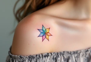 A rainbow-colored eight-pointed star tattoo celebrates inclusivity and universal love. tattoo idea