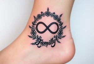 An infinity symbol surrounded by a wreath of wildflowers, with the word "family" flowing beneath tattoo idea