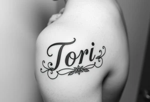 The name Tori on a man’s hand with designs tattoo idea