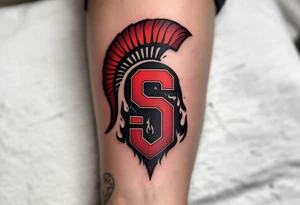 A bold red and burgundy "Sparta" with bold “S” crest wrapped in black flames on the forearm. tattoo idea