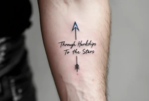 Scrawled in ink that fades from cobalt to silver, the quote “Through Hardships To the Stars” runs under an arrow piercing the clouds skyward. tattoo idea