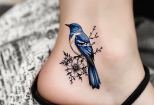 Blue bird with thick floral at the bottom tattoo idea