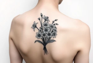 shoulder blade tattoo for women with bouquet of daffodils, daisy, lily of the valley tattoo idea