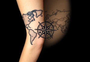 antique compass rose overlaid on weathered world map with sailing ships tattoo idea