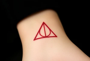 A minimalist Deathly Hallows  full symbol outline in red ink tattoo idea