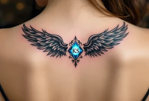A pair of black ink wings cradling a small, glowing blue gem with the son’s initials KS inside. tattoo idea