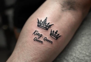 A minimalist black crown pair with the word "King" in bold script and "Queen" in elegant cursive, symbolizing unity in style. tattoo idea