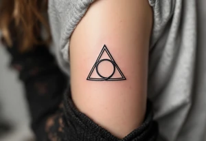 A minimalist black ink triquetra, tattoo idea