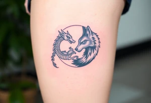 Ying yang symbol with one side a baby dragon and one side a wolf tattoo idea