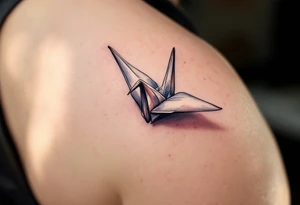 A delicate paper crane folded from pastel watercolor folds, symbolizing peace and free will. tattoo idea