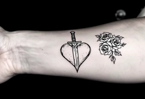 dagger piercing a heart with roses tattoo idea
