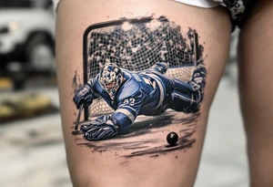 Goalie Diving Save Scene – Realistic scene of a masked goalie in blue pads, diving to block a puck, framed by a blurred crowd and net behind. tattoo idea