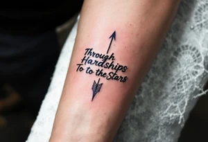 Scrawled in ink that fades from cobalt to silver, the quote “Through Hardships To the Stars” runs under an arrow piercing the clouds skyward. tattoo idea
