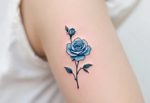 Miniature blue roses outlined in black, with watercolor shading for a dreamy, surreal effect. tattoo idea