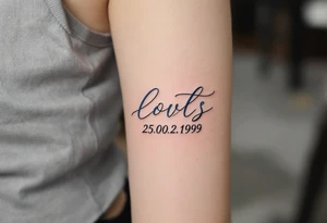 Cursive date 25.02.1999 flowing along the spine in cool gray with a hint of icy blue. tattoo idea