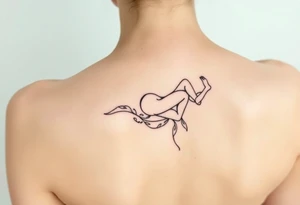 delicate small silhouette of woman lying on her side tattoo idea