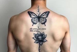 butterfly with cracked wings and lotus flower with quote that says “she wore her scars like wings” all down spine but very elegant towards lower back and small tattoo idea