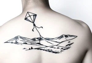 Kite in the country hand holding a kite. Over the hills tattoo idea