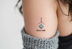 Cursive date 25.02.1999 flowing along the spine in cool gray with a hint of icy blue. tattoo idea