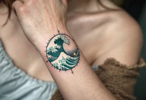 A deep sea green wave with frothy white caps encircles a compass rose on the forearm. tattoo idea