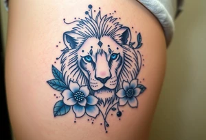 Lion with blue eyes surrounded by larkspur and water lily tattoo idea