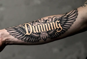 Dunning, left arm details include bold strong font, gold highlights, theme of wealth and angel wings, tattoo idea