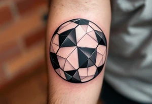 A geometric-style soccer ball made of interlocking black, gray, and metallic silver triangles. tattoo idea