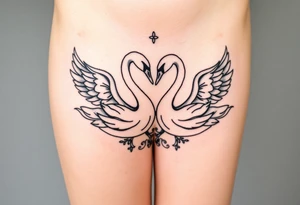 Peaceful swans feminine strength tattoo idea