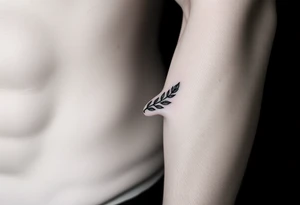 laurel branch with one leaf inverted tattoo idea