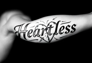 Broken heartHeartless words written in majuscule with broken real heart design tattoo idea
