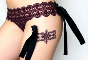 A deep burgundy lace garter tattoo with black velvet ribbon tattoo idea