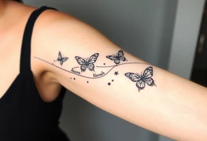 Butterflies streaming down arm with kid names (Aden, Aninna, Novaih, Jayla, Rayla ) in between them with a streamer binding them together tattoo idea