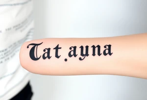 Tatayana name tattoo for a father using old English lettering and sun and moon that starts reading from the wrist to the elbow tattoo idea
