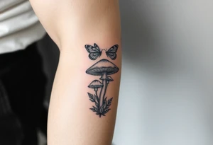 mushroom with 2 butterflies above it on your lower inner arm tattoo idea