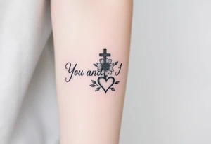 "You and I together" with a cross, a flower and a heart integrated into the design tattoo idea