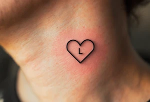 A thin-line geometric heart with a small, understated letter "L" placed subtly inside, for a sleek and contemporary look. tattoo idea