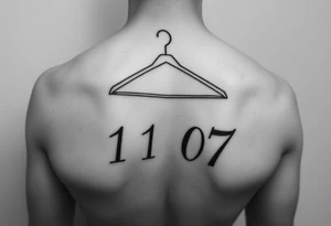 I want a tattoo about 7 cm in size that includes a drawing of a clothes hanger and the numbers 11 07, all in a realistic, beautiful style with stylish lettering tattoo idea