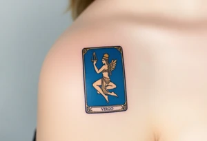 A tarot card featuring the Virgo symbol, with intricate gold detailing and a rich deep blue background tattoo idea